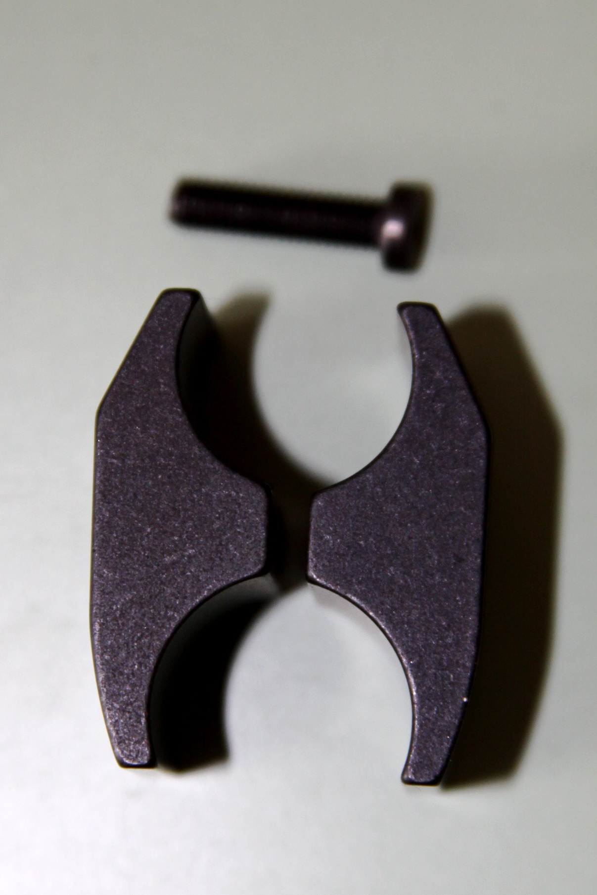 Two halves with mounting screw.