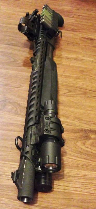 Remington 870 Shotgun with Heatshield, Sidesaddle, Holographic Sight Remington 870 Shotgun with Heatshield, Sidesaddle, Holographic Sight