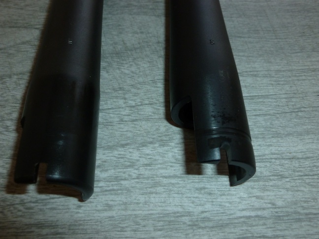 The barrel on the right is the tactical barrel that came with the shotgun. You can see the groove that belts it.