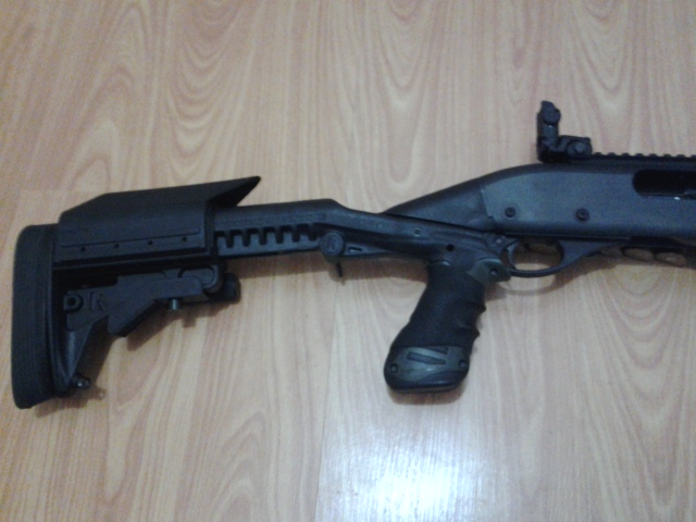 Remington 870 with Knoxx Stock, Powerpak, Blackhawk Powerpak Modular Cheek Piece Kit, Hogue Slip-on Grip Remington 870 with Knoxx Stock, Powerpak, Blackhawk Powerpak Modular Cheek Piece Kit, Hogue Slip-on Grip